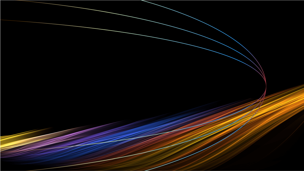 Coloured trails of light on a dark background
