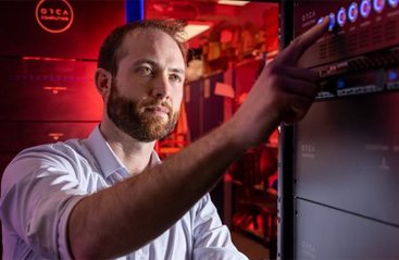 ORCA researcher working with a photonic quantum computer