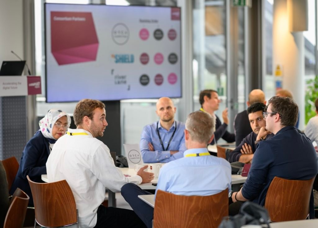 Participants discussing quantum applications at a Digital Catapult workshop