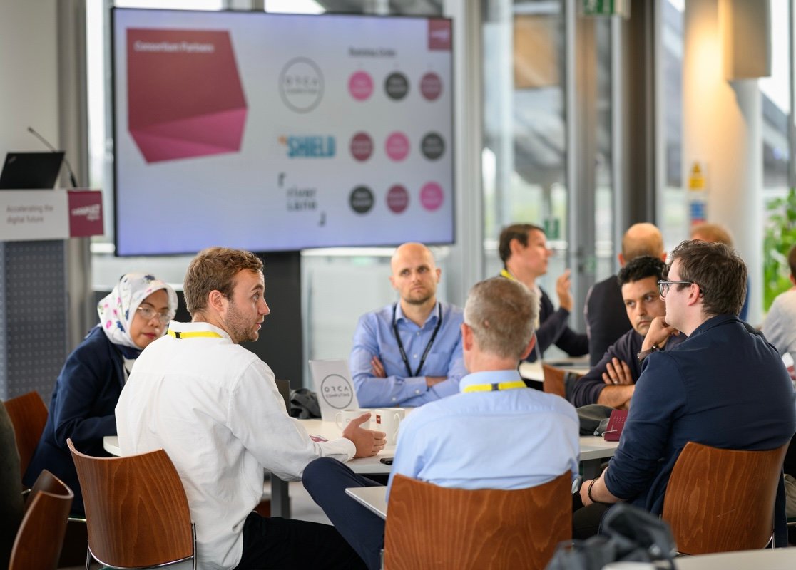 Participants discussing quantum applications at a Digital Catapult workshop