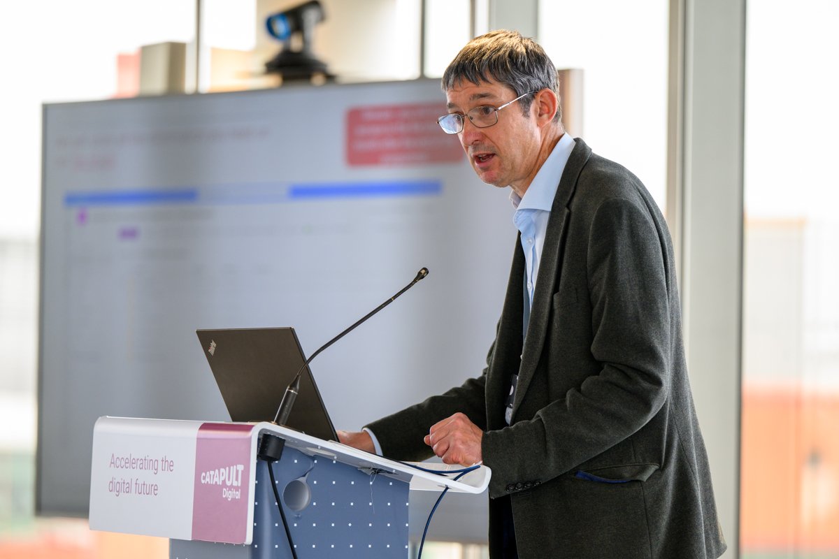 Researcher presenting work at a lectern