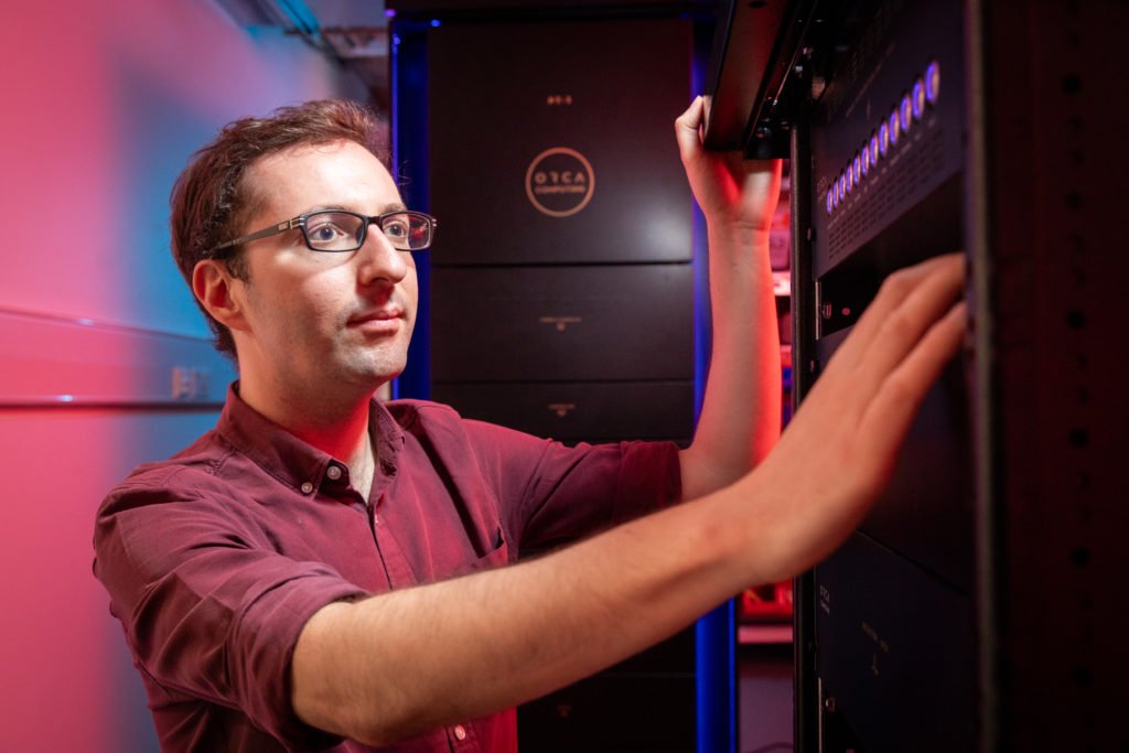 ORCA researcher working with a photonic quantum computer