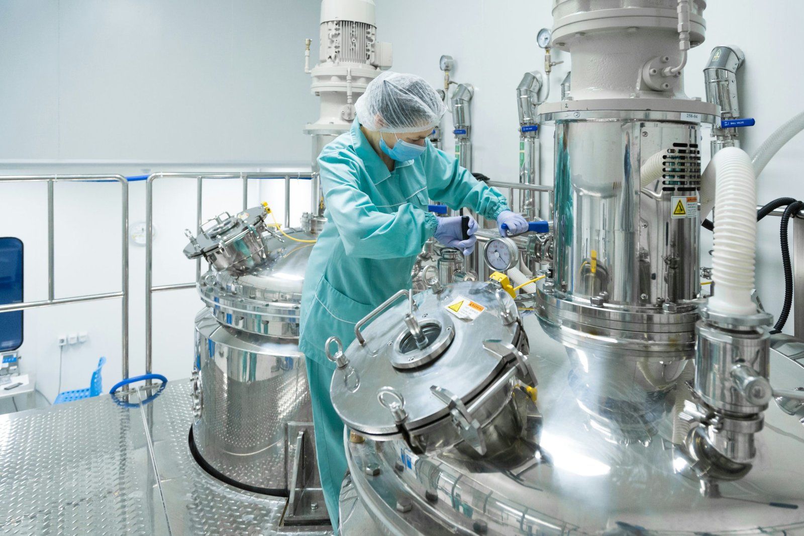 Scientist working with biomanufacturing equipment