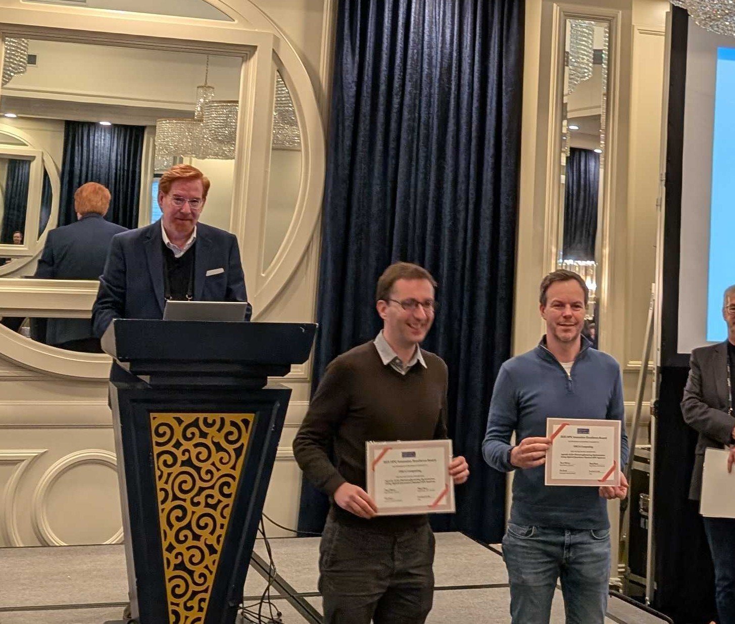 ORCA Computing and SiC Systems representatives receiving an HPC innovation award