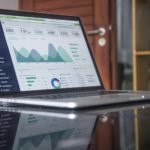 Laptop displaying charts and analytics