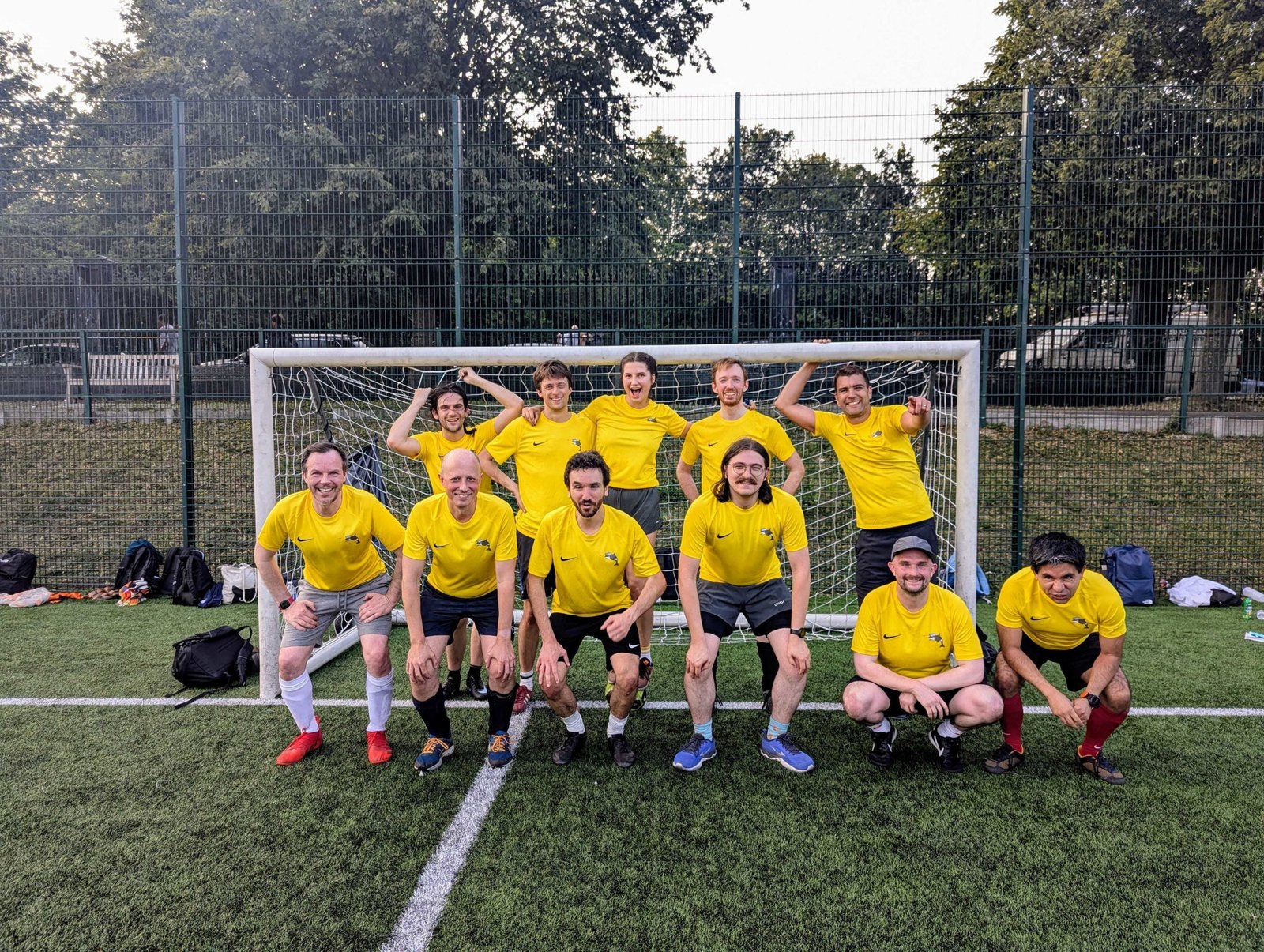 ORCA Computing colleagues posing together on a football pitch